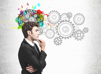 Pensive young businessman, brainstorming concept