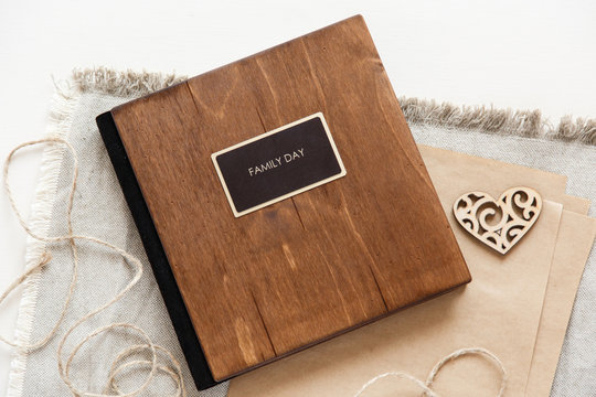 family album with wooden cover. Book or notebook with inscription "family day"