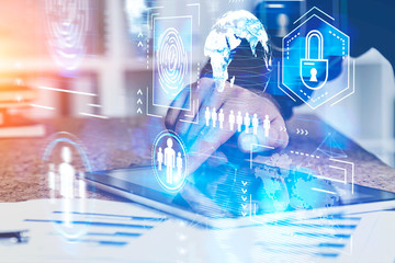 Businessman using tablet in office, cyber security