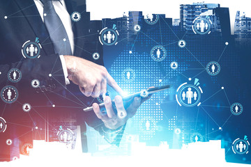 Man using tablet in city, HR icons