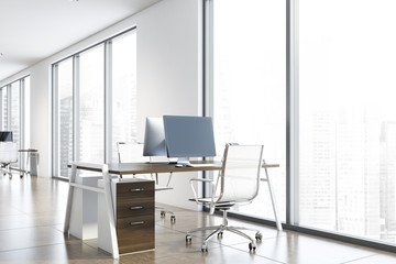 Workplace in white open space office