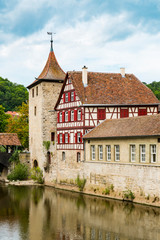 Fototapeta premium Half timbered houses and Sulfer tower along river Kocher in Schwabisch Hall, Germany