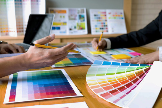 Graphic designers choose colors from the color bands samples for design .Designer graphic creativity work concept .