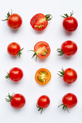 Fresh tomatoes, whole and half cut isolated on white background.