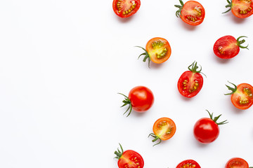 Fresh tomatoes, whole and half cut isolated on white background.