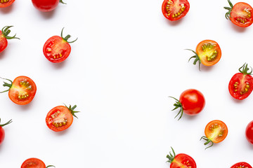 Fresh tomatoes, whole and half cut isolated on white background.