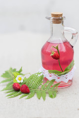 tasty homemade syrup with wild forest fruits