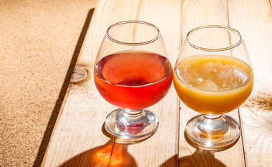 Glasses of fruit drinks are on the table.
