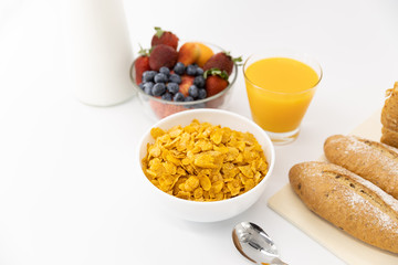 Healthy breakfast. bread, orange juice, strawberry, blueberries, milk and cereal in bowl on white background. Healthy food