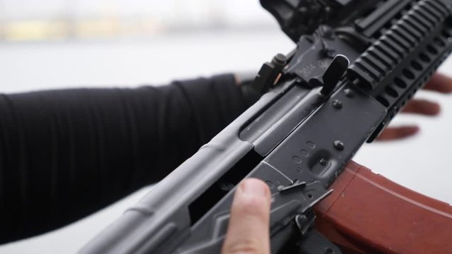 Soldier reload AK 47 Kalashnikov assault rifle.