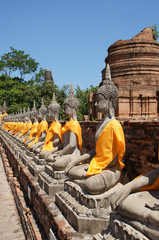 Fototapeta na wymiar Row of Buddha Statues at Wat Yai Chaimongkol, Ayutthaya, Thailand