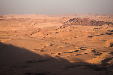 Fototapeta na wymiar sunset in the desert with roads 