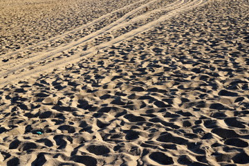 footprints in the sand on the shores of the Mediterranean Sea in the north of Israel