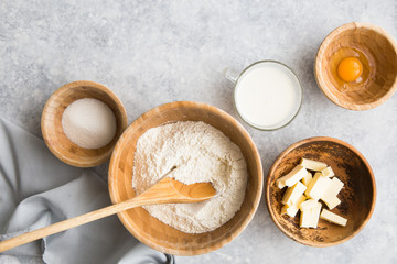 Fototapeta premium Baking concept, baking ingredients on background. Ingredients for baking cake, cookies, bread or pastry. Frame of cooking kitchen utensils and food