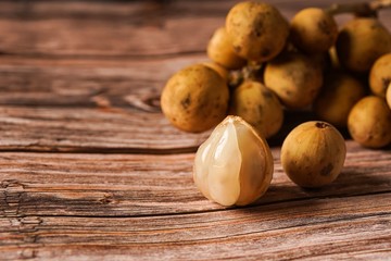Lansium parasiticum, commonly known in English as langsat or lanzones, is a species of tree in the Mahogany family with commercially cultivated edible fruits. The species is native to South East Asia