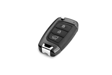 Typical wireless car key isolated on white background. Keyless entry remote key to modern vehicle. Device with buttons: lock, unlock doors and trunk opening. No metal shaft.