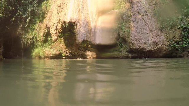 Swimming at Kalamari waterfall near Gialova village in Greece.
