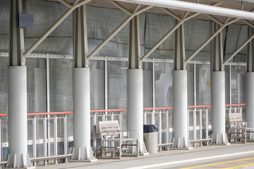 canopy over the bus stop from rain and sun, a bench to wait for a train or train. long distance...