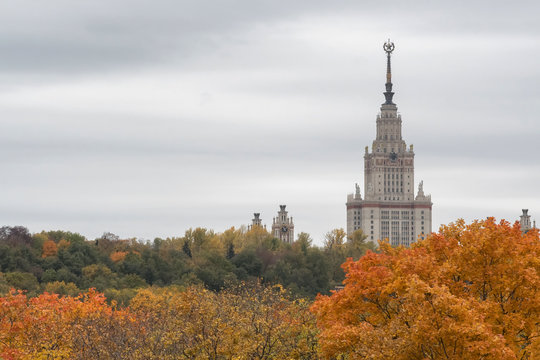 Moscow autumn. View at Moscow State University towering over the autumn forest.  Moscow, Russia.
