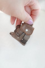 Miniature leather backpack. Small backpack on a palm