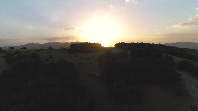 Aerial motion view of sunset in mountains