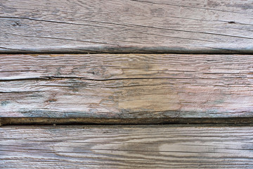 Background of old gray wooden boards. Horizontal photo, wallpaper.