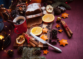 christmas hot mulled wine with cinnamon cardamom and anise on wooden background