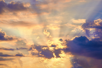 Naklejka na ściany i meble Sunset sky with sun coming through the cloud