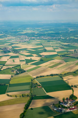 Aerial seen from Airplane over Germany. Fields and Small Towns seen from above