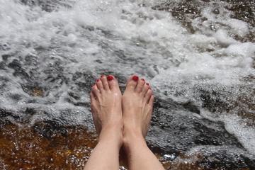 Woman's feet and water