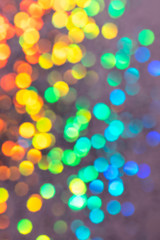 Colorful prism confetti blurred festive backdrop, trendy sparkles and glitter background, flat lay style. Christmas and holidays concept