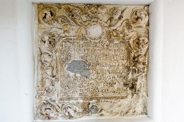 Ancient bas-relief with an inscription in old Russian in an Orthodox monastery