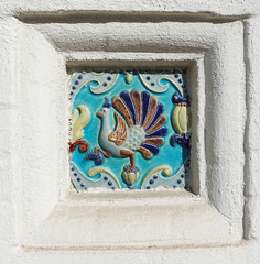 Image of a bird on ceramic tile. Ancient decoration of the ancient orthodox church.