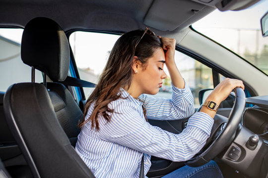 Stressed woman drive car feeling sad and angry. Asian girl tired, fatigue mental on car. Sleepy and drunk female hangover. Illegal law driver license. Driving when tired and don’t drive drowsy concept