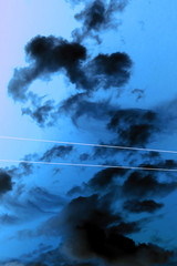 abstract black clouds on a blue sky