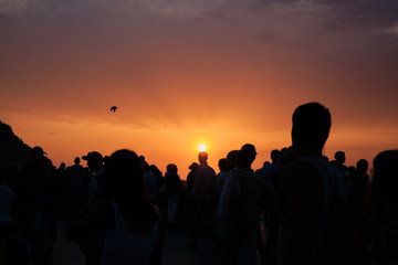 Fototapeta na wymiar Silhouettes of people at sunset