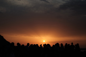 Fototapeta na wymiar Silhouettes of people at sunset