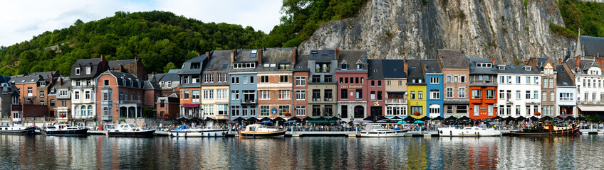 panorama view of the small town of Dinant on the Maas river with the historic river front - obrazy, fototapety, plakaty