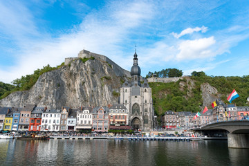 Fototapeta na wymiar view of the small town of Dinant with Maas river and citadel and cathedral in the old town