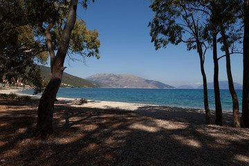 Trees provide welcome shade from the heat at Sami beach on the eastern coast of the Greek island of Kefalonia