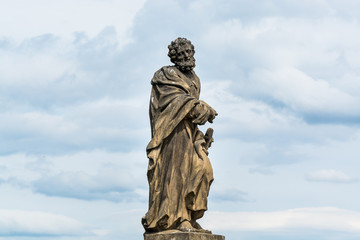 Obraz premium Statue of St. Jude Thaddeus on the Charles bridge, Prague – Sculpted by Jan Oldřich Mayer in 1708.depicts St. Jude holding a rod.