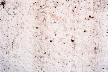 Texture of a concrete wall with cracks and scratches which can be used as a background