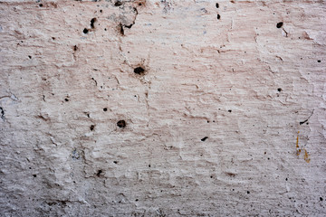 Texture of a concrete wall with cracks and scratches which can be used as a background