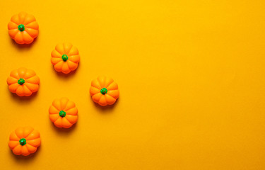Halloween holiday concept, Pumpkin in orange background with copy space for text, Top flat view wallpaper