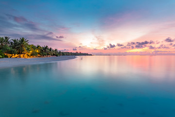 Closeup of sea beach and colorful sunset sky. Panoramic beach landscape. Empty tropical beach and...