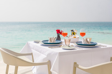 Fresh breakfast in a beautiful location with sea views. Luxury summer vacation or honeymoon...