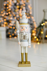 Classic vintage nutcracker on New Year background. Wooden toy nutcracker, classic decorations....