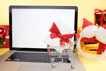 Tula, 28 09 19: shopping online concept. Credit card and laptop with christmas gifts and boxes