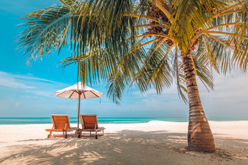 Beautiful Maldives island beach landscape. Luxury resort with chairs and umbrella for summer vacation and holiday background. Exotic tropical beach concept