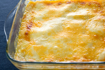 Lasagne just right of the oven in a closeup shot.